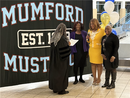 Judge Alicia Jones Coleman swears in Board of Education Incumbent Sherry Gay-Dagnogo at Mumford High School on Dec. 4, 2024